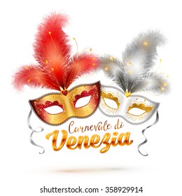 Carnevale di Venezia (Venice Carnival) sign with two bright carnival masks with feathers