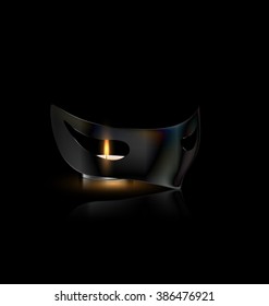 carnival half mask with small burning candle