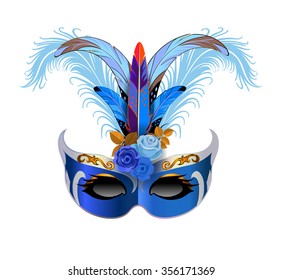 Carnival mask with blue feathers and blue roses for the festivities.