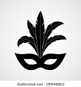 Carnival mask with feathers black silhouette. Vector icon