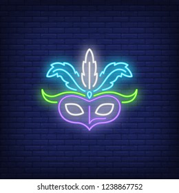 Carnival mask neon sign. Festival or advertisement design. Night bright neon sign, colorful billboard, light banner. Vector illustration in neon style.