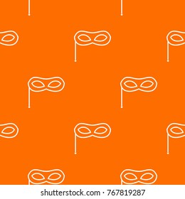 Carnival mask pattern repeat seamless in orange color for any design. Vector geometric illustration