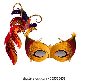 Carnival Venetian mask decorated with orange, brown and blue feathers. The mask decorated with golden pattern.