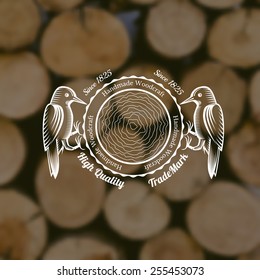 carpenter craft style background with woodpecker around cut down a tree middle on old stack of wood blur photo