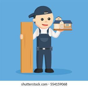 carpenter with wood and house miniature