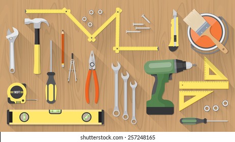 Carpentry and home renovation tools on a wooden table top view