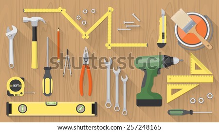 Carpentry and home renovation tools on a wooden table top view