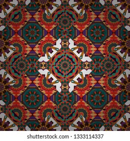 Carpet with ethnic ornament. Vector seamless pattern, luxurious colourful old design. Motley center in red, orange and brown tones.
