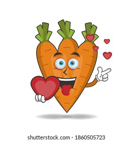 Carrot mascot character holding a love icon. vector illustration