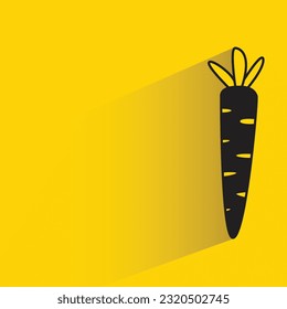 carrot with shadow on yellow background