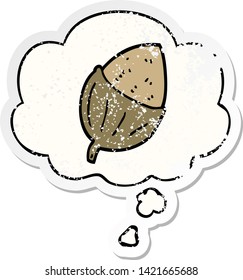 cartoon acorn with thought bubble as a distressed worn sticker