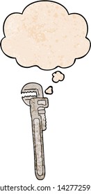 cartoon adjustable wrench with thought bubble in grunge texture style