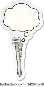 llave inglesa ajustable de dibujos animados con burbuja de pensamiento como pegatina gastada angustiada