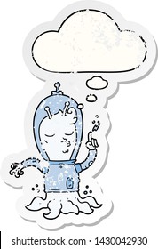 cartoon alien with thought bubble as a distressed worn sticker