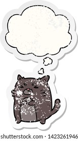 cartoon angry cat with thought bubble as a distressed worn sticker