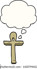 cartoon ankh symbol with thought bubble