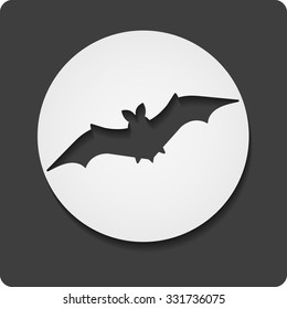Cartoon bat in circle with shadow isolated on black background. Flat vector symbol. EPS 10