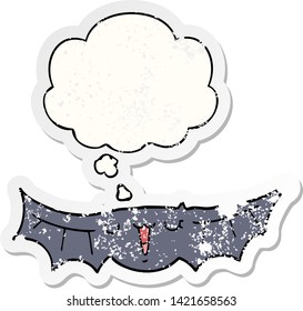 cartoon bat with thought bubble as a distressed worn sticker