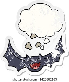 cartoon bat with thought bubble as a distressed worn sticker