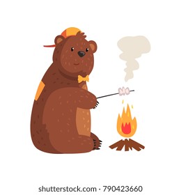 Cartoon bear frying marshmallow on fire in woods. Adorable grizzly in cap and bow tie. Wild animal with brown fur, small rounded ears and paws with claws. Flat vector