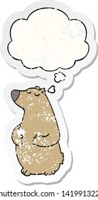 cartoon bear with thought bubble as a distressed worn sticker