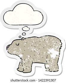 cartoon bear with thought bubble as a distressed worn sticker