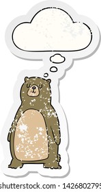 cartoon bear with thought bubble as a distressed worn sticker