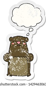 cartoon bear with thought bubble as a distressed worn sticker
