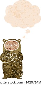cartoon bear with thought bubble in grunge distressed retro textured style
