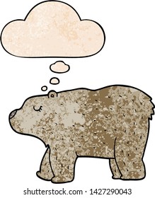 cartoon bear with thought bubble in grunge texture style