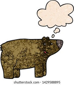 cartoon bear with thought bubble in grunge texture style