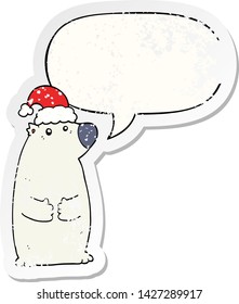 cartoon bear wearing christmas hat with speech bubble distressed distressed old sticker