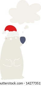 cartoon bear wearing christmas hat with thought bubble in retro style