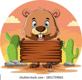 The cartoon of the beaver holding the blank wooden board and standing near the cactus