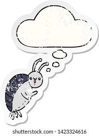 cartoon beetle with thought bubble as a distressed worn sticker