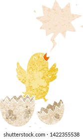 cartoon bird hatching from egg with speech bubble in grunge distressed retro textured style