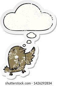 cartoon bird with thought bubble as a distressed worn sticker
