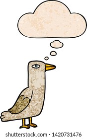cartoon bird with thought bubble in grunge texture style