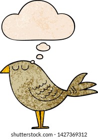 cartoon bird with thought bubble in grunge texture style