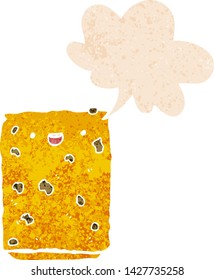 cartoon biscuit with speech bubble in grunge distressed retro textured style