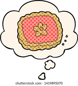 cartoon biscuit with thought bubble in comic book style