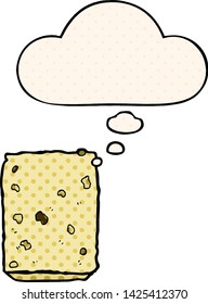 cartoon biscuit with thought bubble in comic book style