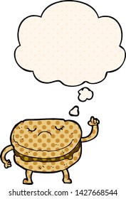 cartoon biscuit with thought bubble in comic book style