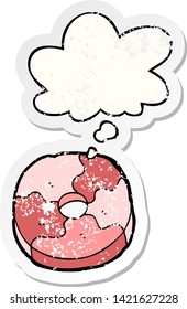 cartoon biscuit with thought bubble as a distressed worn sticker
