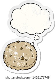 cartoon biscuit with thought bubble as a distressed worn sticker