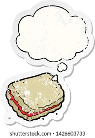 cartoon biscuit with thought bubble as a distressed worn sticker