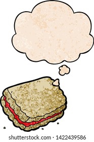cartoon biscuit with thought bubble in grunge texture style