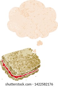 cartoon biscuit with thought bubble in grunge distressed retro textured style