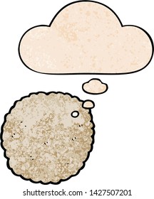 cartoon biscuit with thought bubble in grunge texture style
