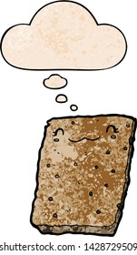cartoon biscuit with thought bubble in grunge texture style